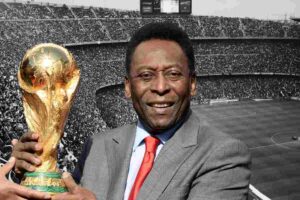 Pelè e la coppa del mondo sullo sfondo uno stadio